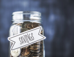 Glass jar filled with coins